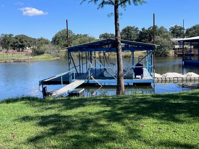 a view of a park with iron fence