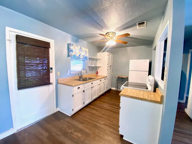a kitchen with stainless steel appliances granite countertop a stove and a refrigerator