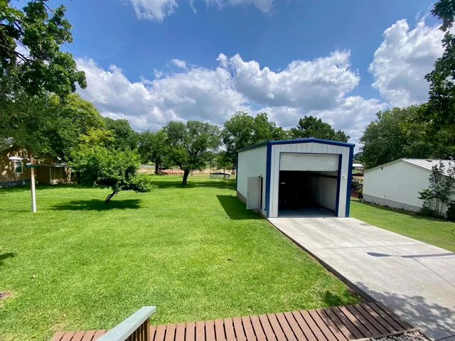 a view of house with yard