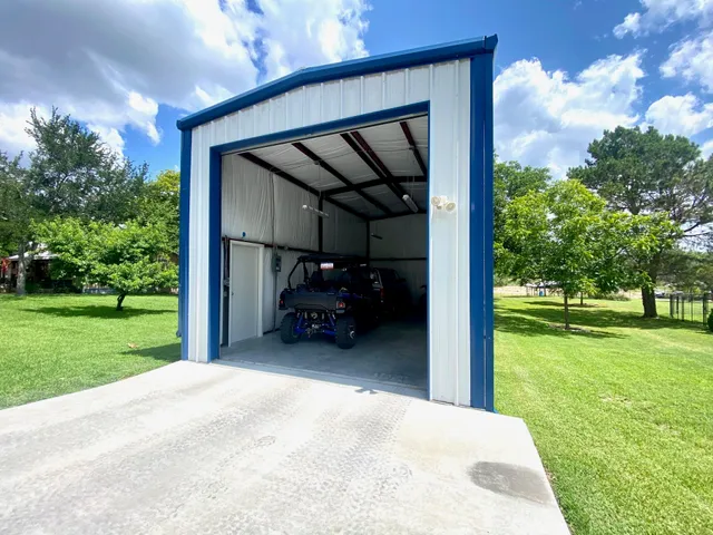 a view of two couches in the patio next to a yard