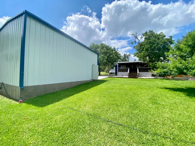 a view of a backyard with a garden and plants