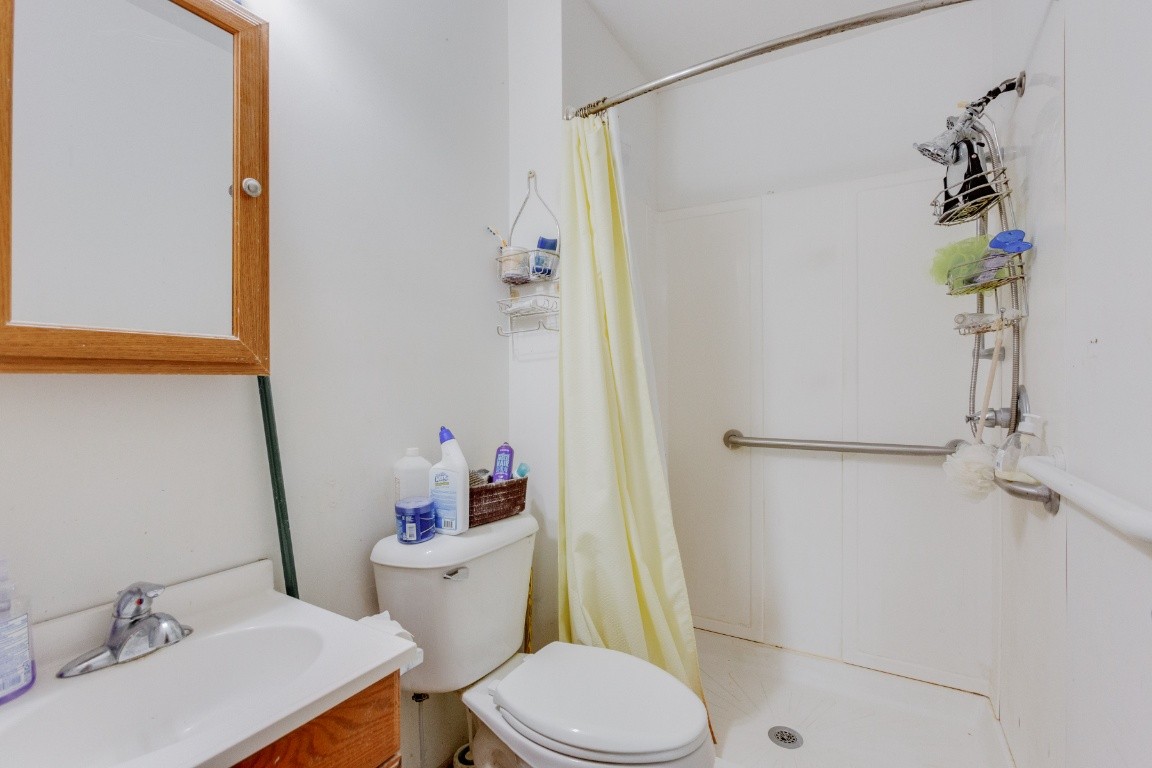 416 Keysburg Road Adams, TN 37010 - Photo 18 of 27 a white toilet sitting next to a bathroom sink