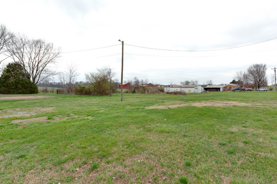 416 Keysburg Road Adams, TN 37010 - Photo 24 of 27 a view of a field with a big yard