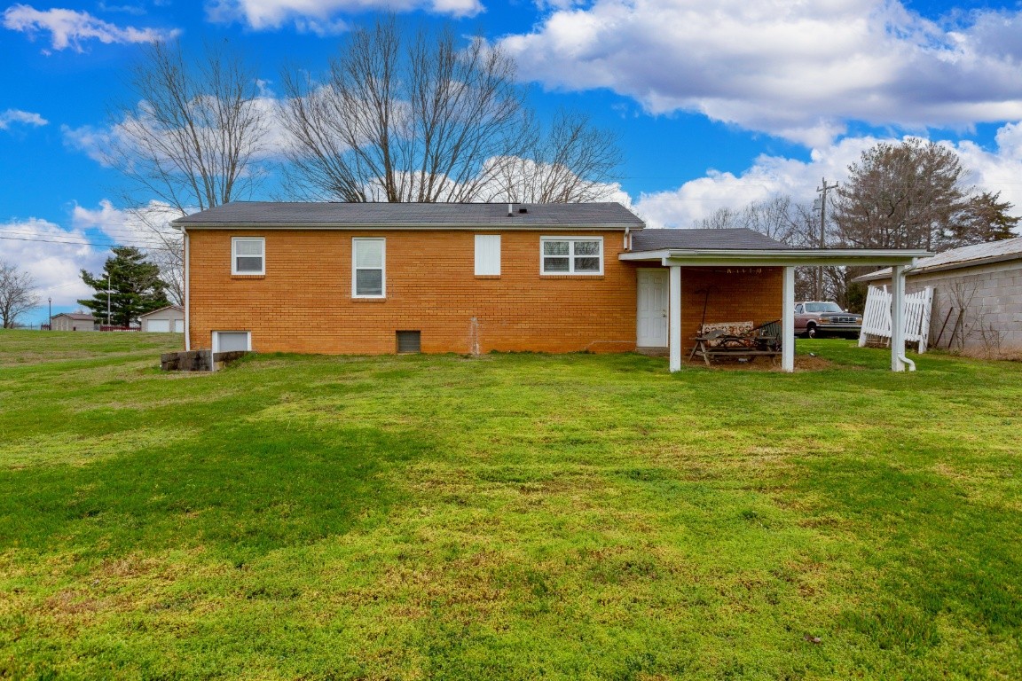 416 Keysburg Road Adams, TN 37010 - Photo 27 of 27 a front view of a house with a yard