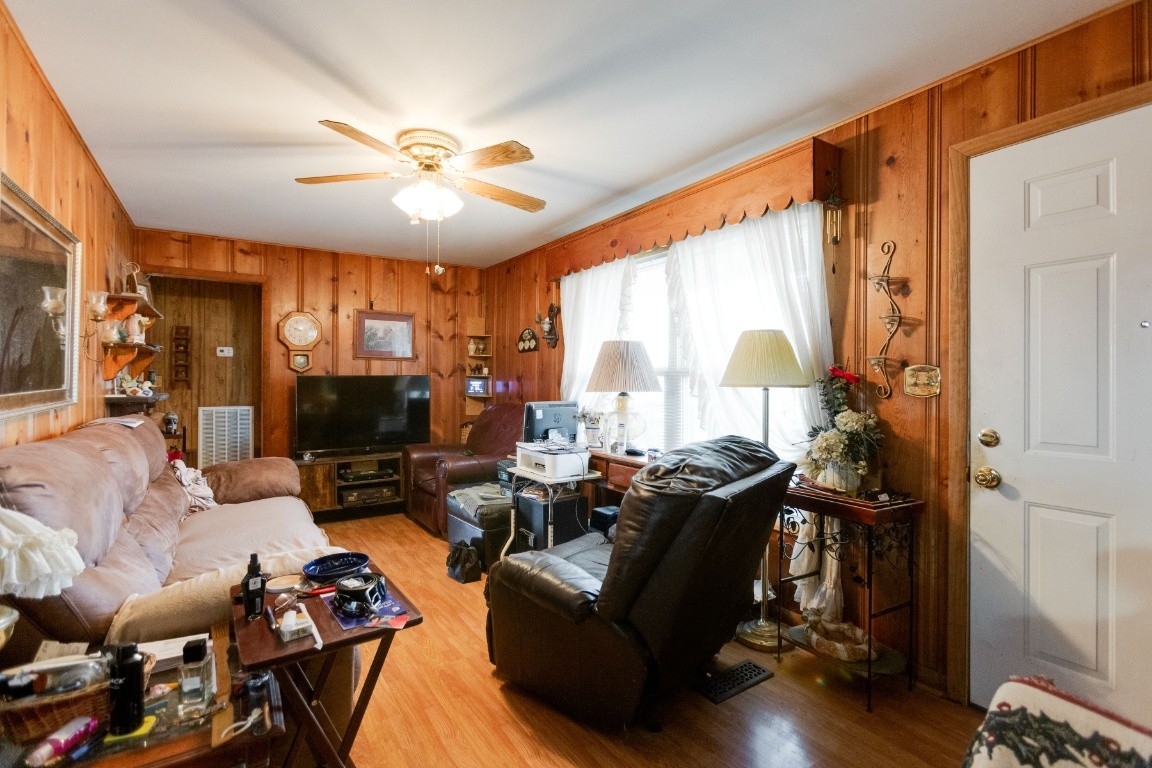 416 Keysburg Road Adams, TN 37010 - Photo 6 of 27 a living room with furniture a large window and a flat screen tv