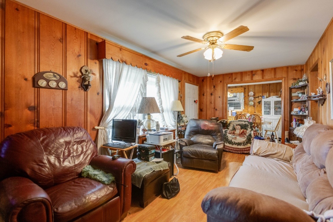 416 Keysburg Road Adams, TN 37010 - Photo 7 of 27 a living room with furniture a ceiling fan and a large window