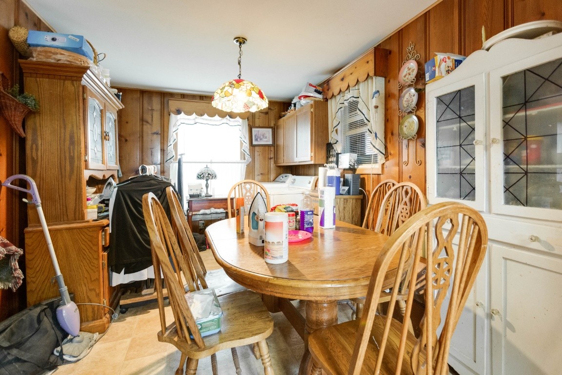 416 Keysburg Road Adams, TN 37010 - Photo 8 of 27 a view of a dining room with furniture and chandelier