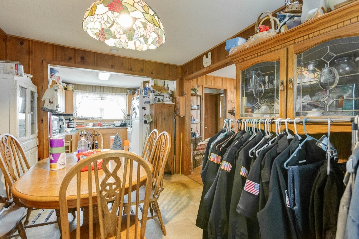 416 Keysburg Road Adams, TN 37010 - Photo 9 of 27 a view of a dining room with furniture and a chandelier