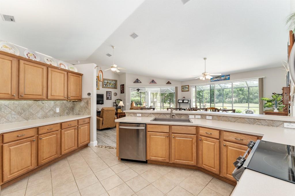 19115 Southwest 98th Loop Dunnellon, FL 34432 - Photo 14 of 36 a kitchen with sink cabinets and window