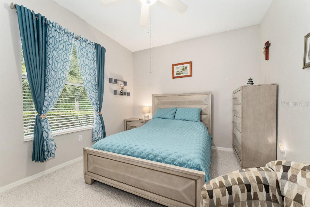 19115 Southwest 98th Loop Dunnellon, FL 34432 - Photo 27 of 36 a bedroom with a bed and window