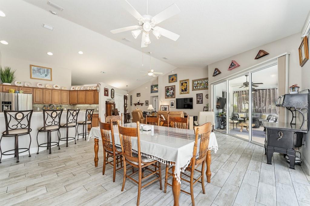19115 Southwest 98th Loop Dunnellon, FL 34432 - Photo 10 of 36 a dining room with furniture and wooden floor