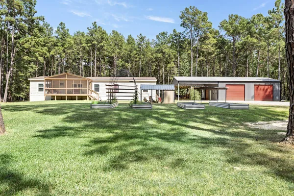 a house view with a sitting space and garden view