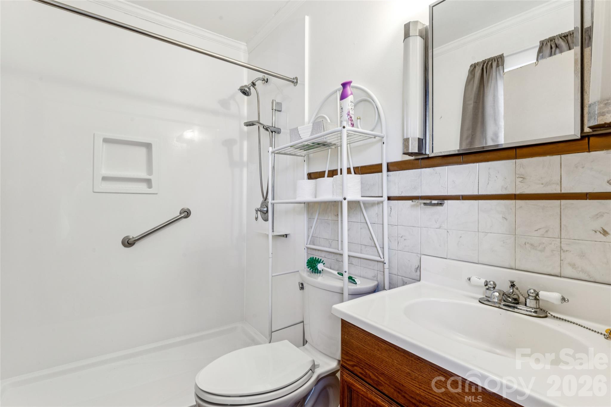 7910 Highway 90 Stony Point, NC 28678 - Photo 20 of 28 a bathroom with a sink a toilet and shower