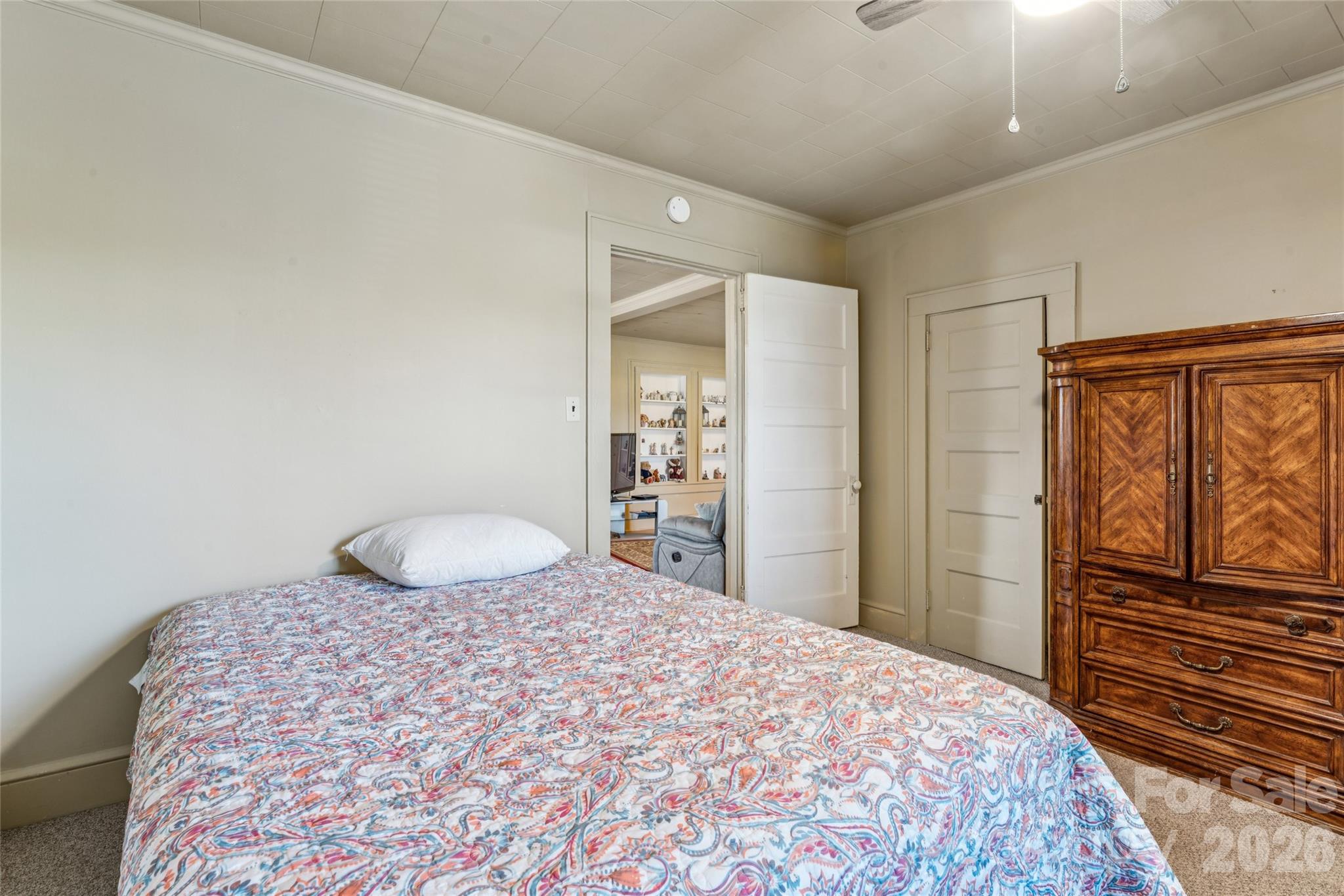7910 Highway 90 Stony Point, NC 28678 - Photo 22 of 28 a bedroom with a bed and cabinets
