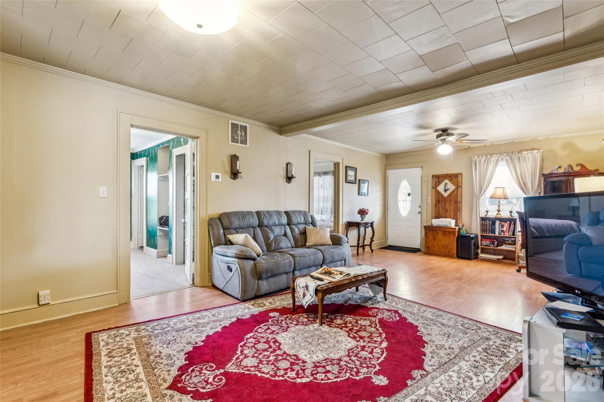 7910 Highway 90 Stony Point, NC 28678 - Photo 4 of 28 a living room with furniture rug and wooden floor
