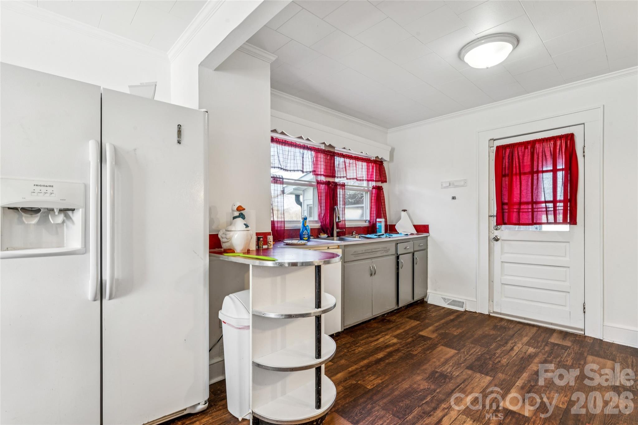 7910 Highway 90 Stony Point, NC 28678 - Photo 8 of 28 a kitchen with a refrigerator and window