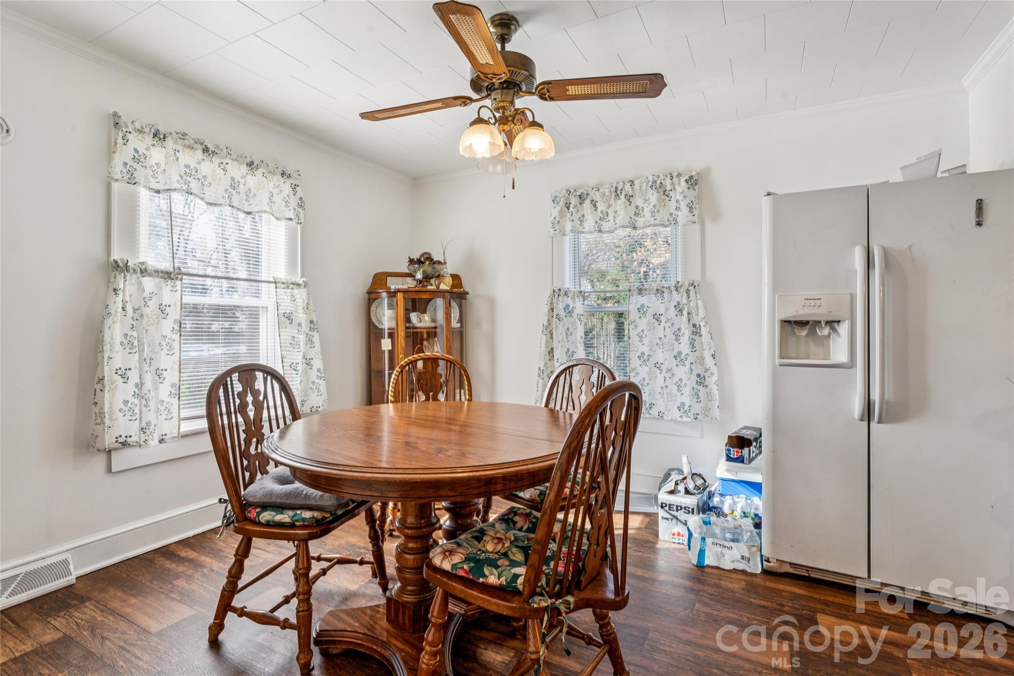 7910 Highway 90 Stony Point, NC 28678 - Photo 10 of 28 a dining room with furniture a chandelier and wooden floor