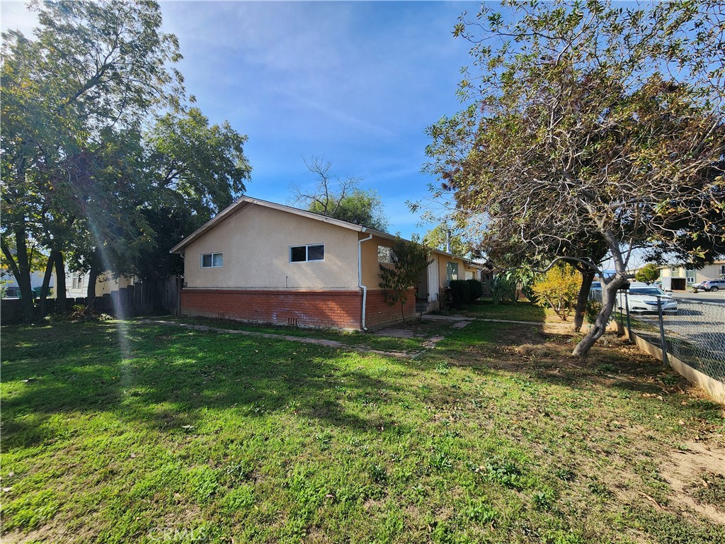 1701 Yolo Street Corning, CA 96021 - Photo 1 of 1 a view of backyard with tree and deck