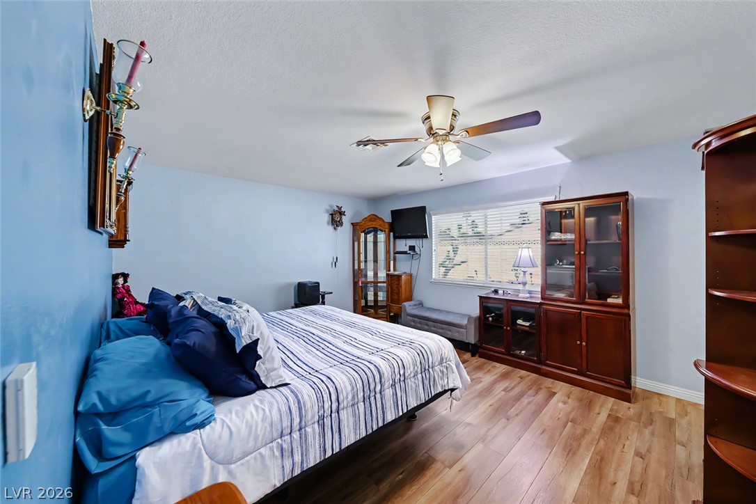 3107 Trueno Road Henderson, NV 89014 - Photo 23 of 37 Hardwood floors and a tranquil ambiance define this comfortable sleeping space.