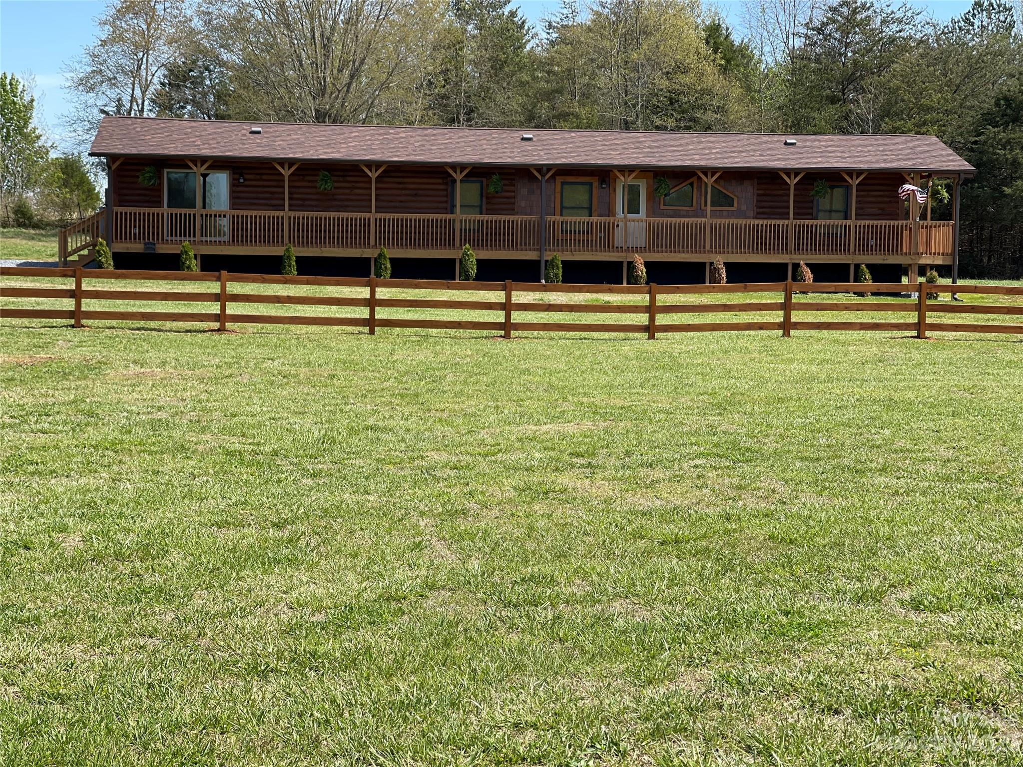 767 Scoggins Road Rutherfordton, NC 28139 - Photo 1 of 27 a view of a yard with lots of trees
