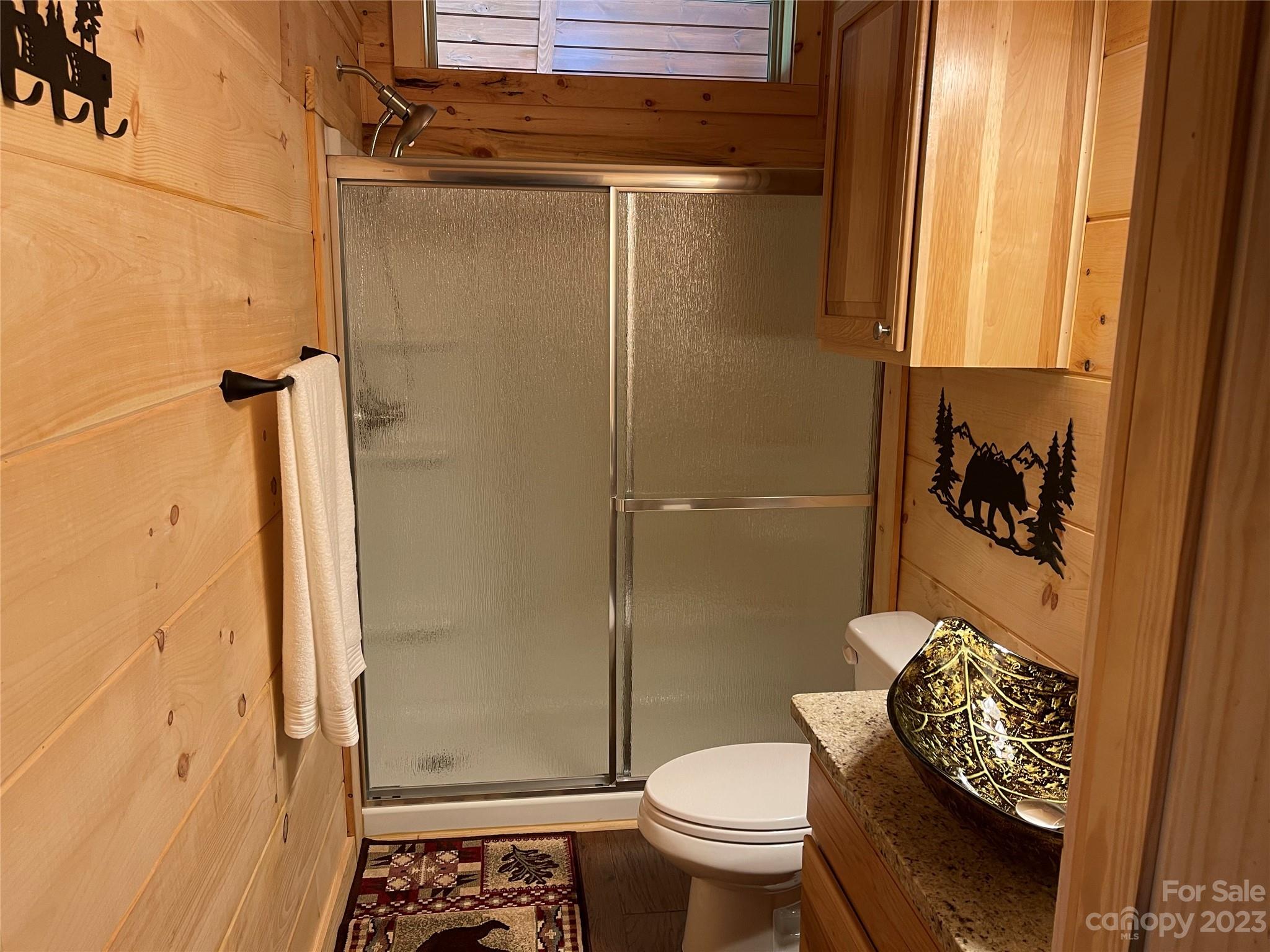 767 Scoggins Road Rutherfordton, NC 28139 - Photo 15 of 27 a bathroom with a toilet and a shower