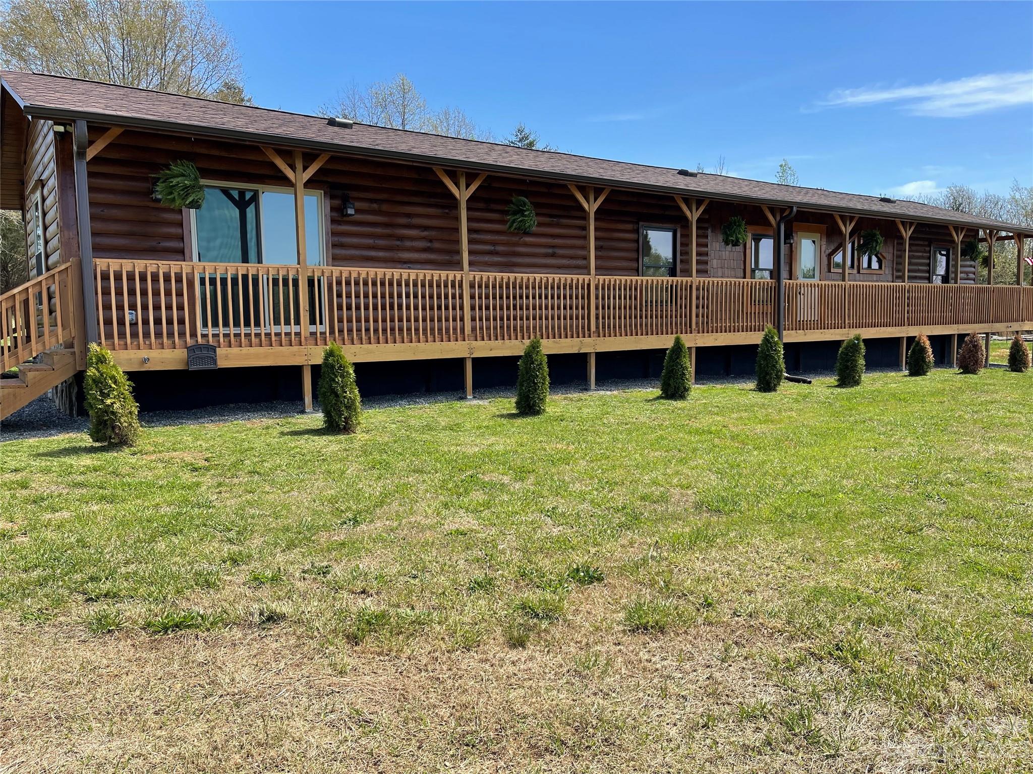 767 Scoggins Road Rutherfordton, NC 28139 - Photo 2 of 27 a view of a house with backyard and porch
