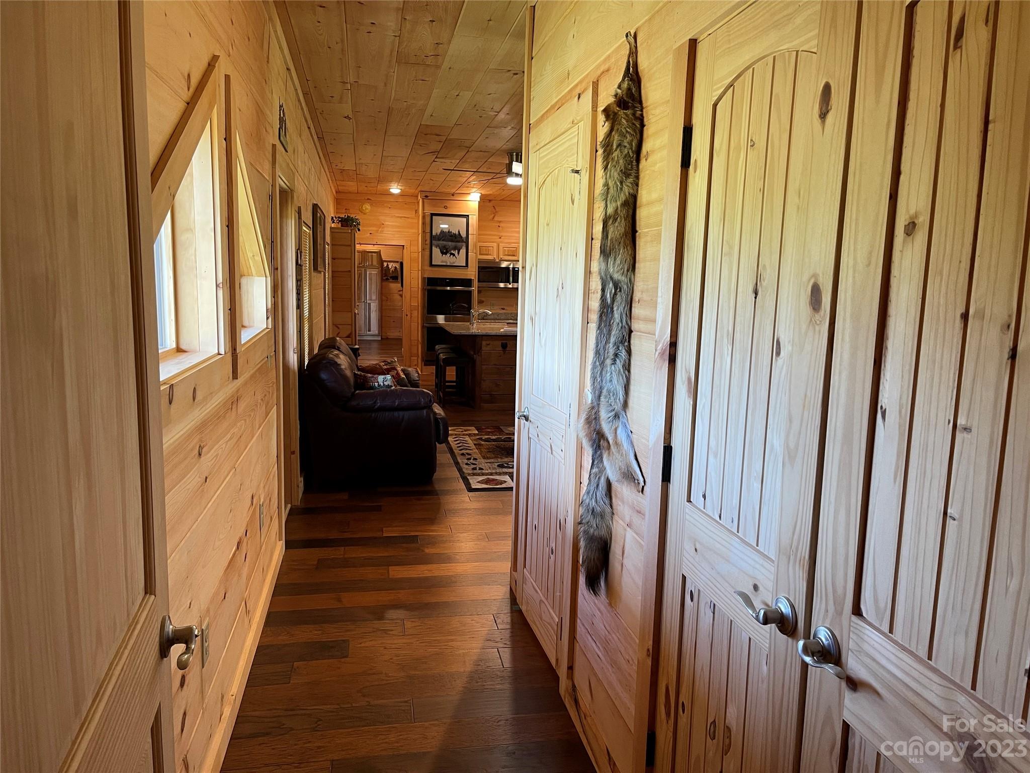 767 Scoggins Road Rutherfordton, NC 28139 - Photo 22 of 27 a view of a hallway with wooden floor and staircase