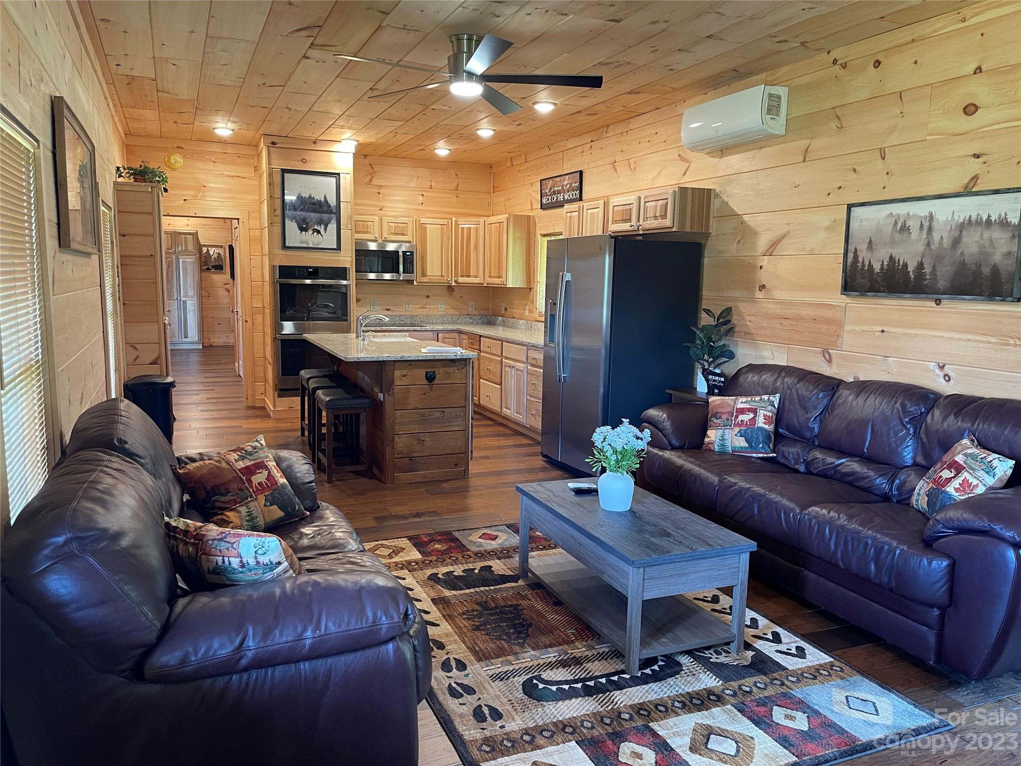 767 Scoggins Road Rutherfordton, NC 28139 - Photo 6 of 27 a living room with furniture and kitchen view