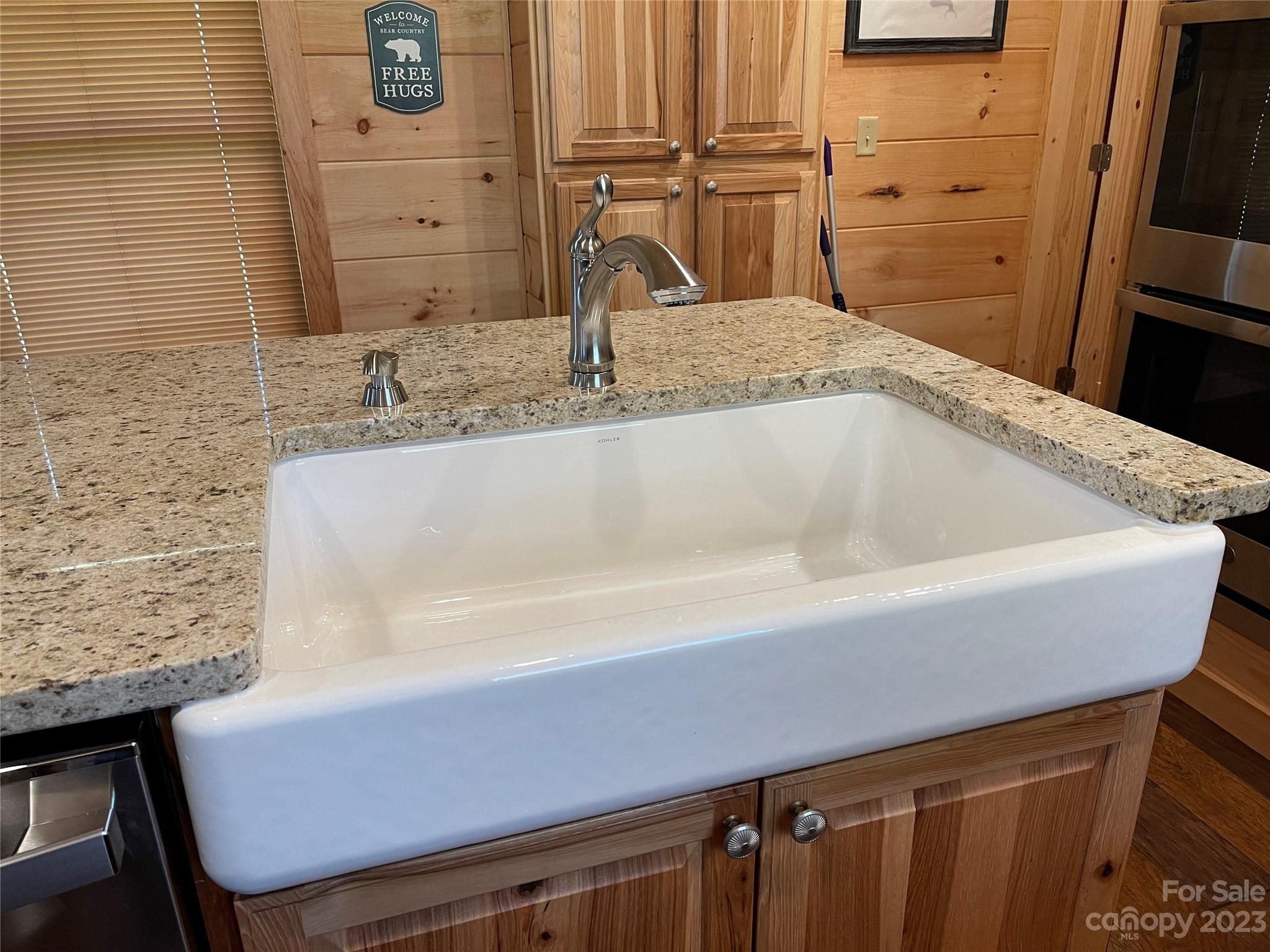 767 Scoggins Road Rutherfordton, NC 28139 - Photo 9 of 27 a bathroom with a granite countertop sink and a mirror