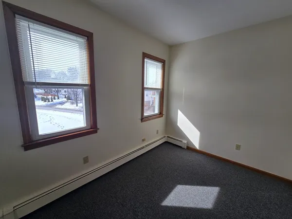 an empty room with closet area