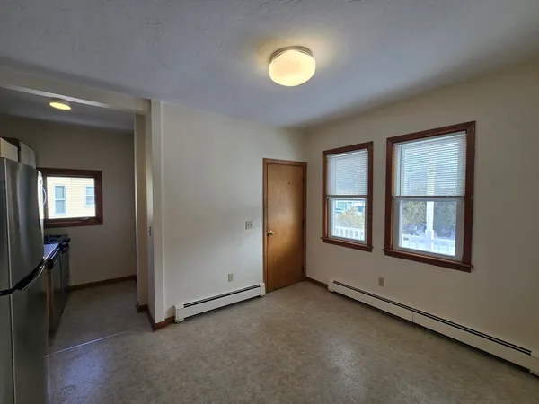 a kitchen with stainless steel appliances a refrigerator and a stove top oven