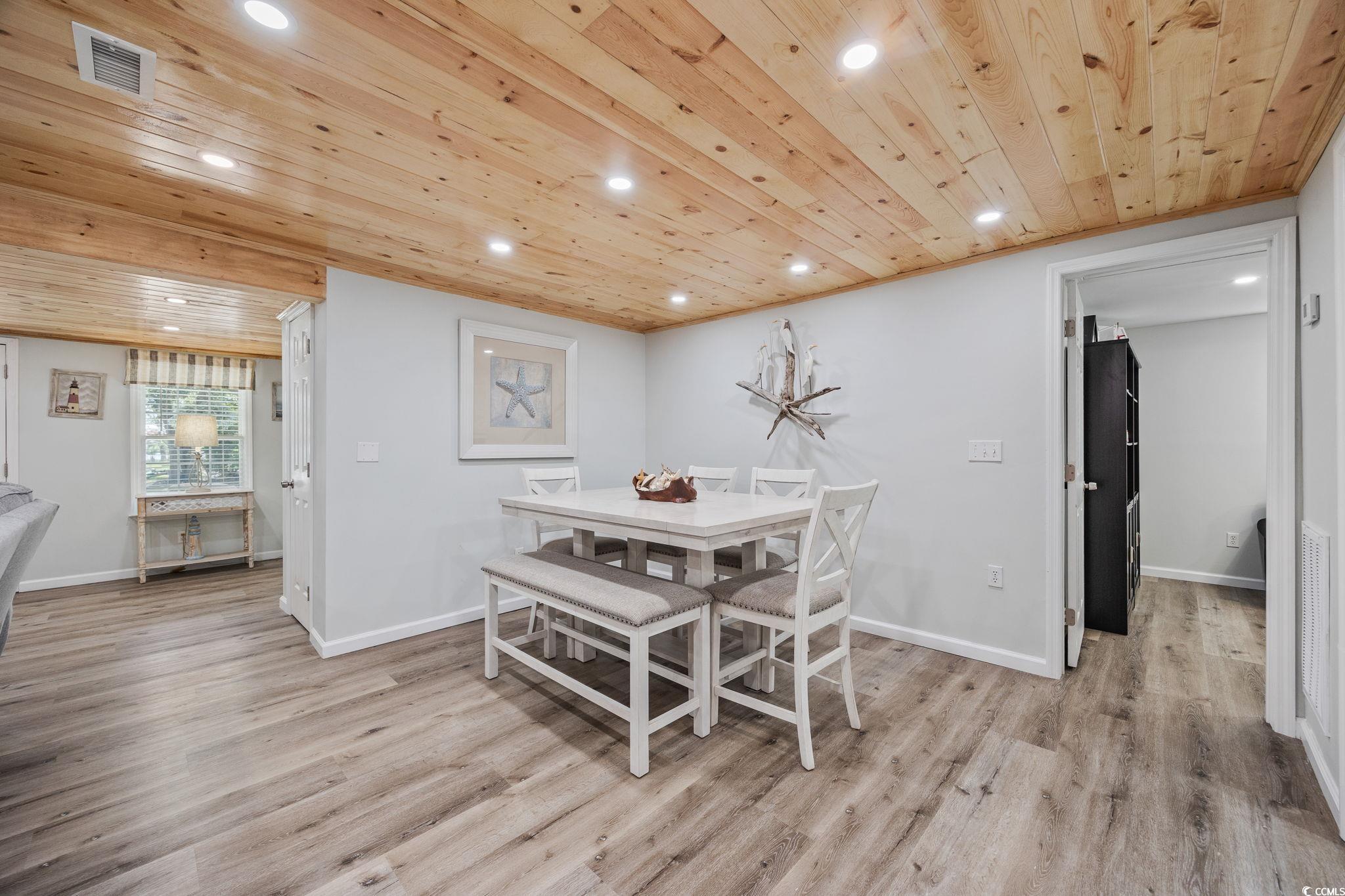 3118 State Rd S-26-816 Murrells Inlet, SC 29576 - Photo 13 of 40 Dining space featuring light wood-style floors, recessed lighting, and wooden ceiling