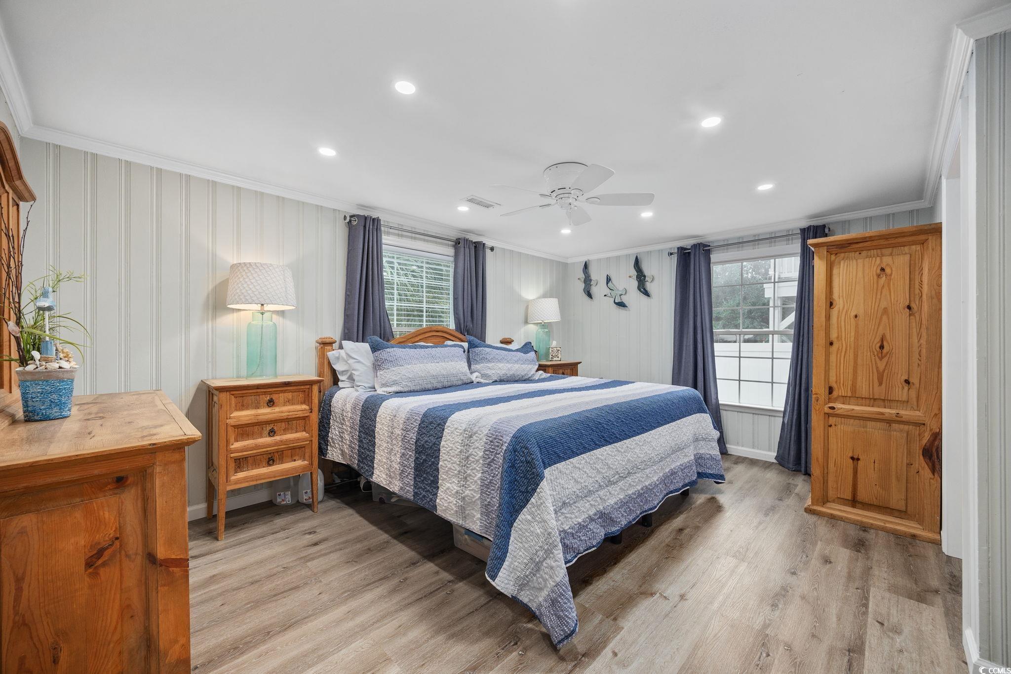 3118 State Rd S-26-816 Murrells Inlet, SC 29576 - Photo 17 of 40 Bedroom featuring crown molding, light wood-type flooring, recessed lighting, and a ceiling fan