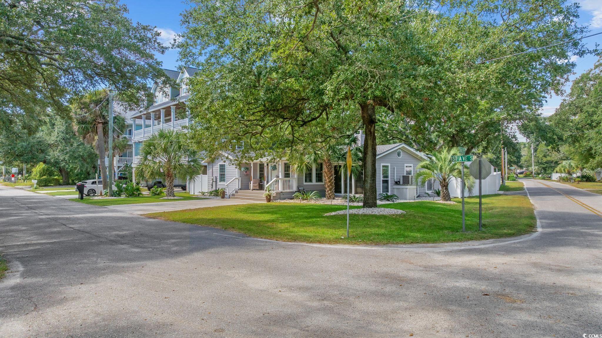 3118 State Rd S-26-816 Murrells Inlet, SC 29576 - Photo 2 of 40 View of front facade featuring a front yard