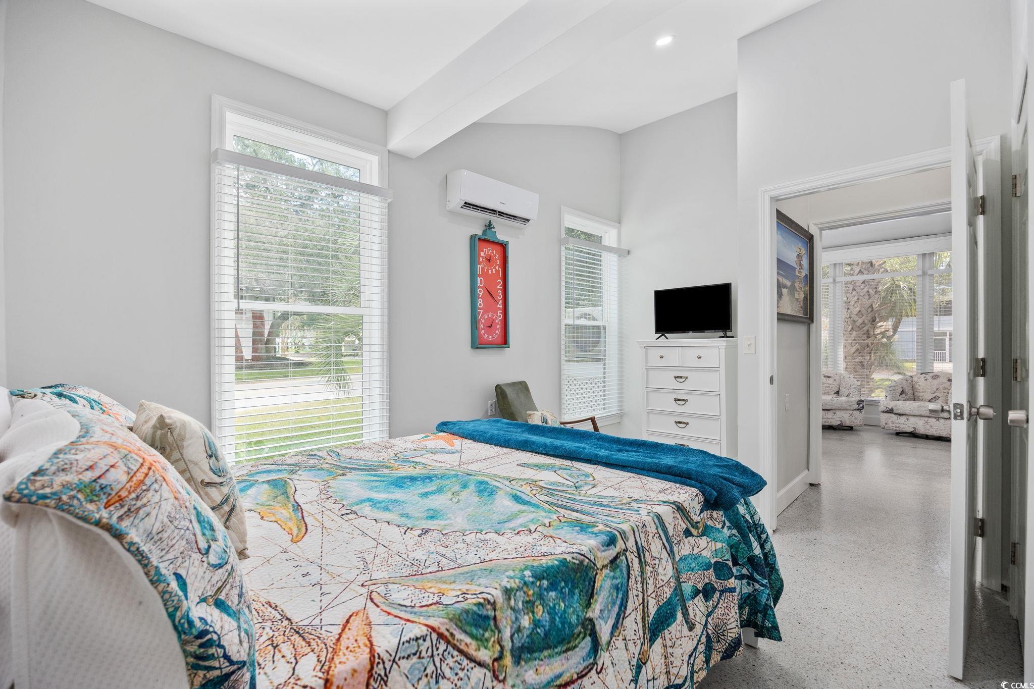3118 State Rd S-26-816 Murrells Inlet, SC 29576 - Photo 22 of 40 Bedroom with multiple windows, dark speckled floor, beamed ceiling, and an AC wall unit