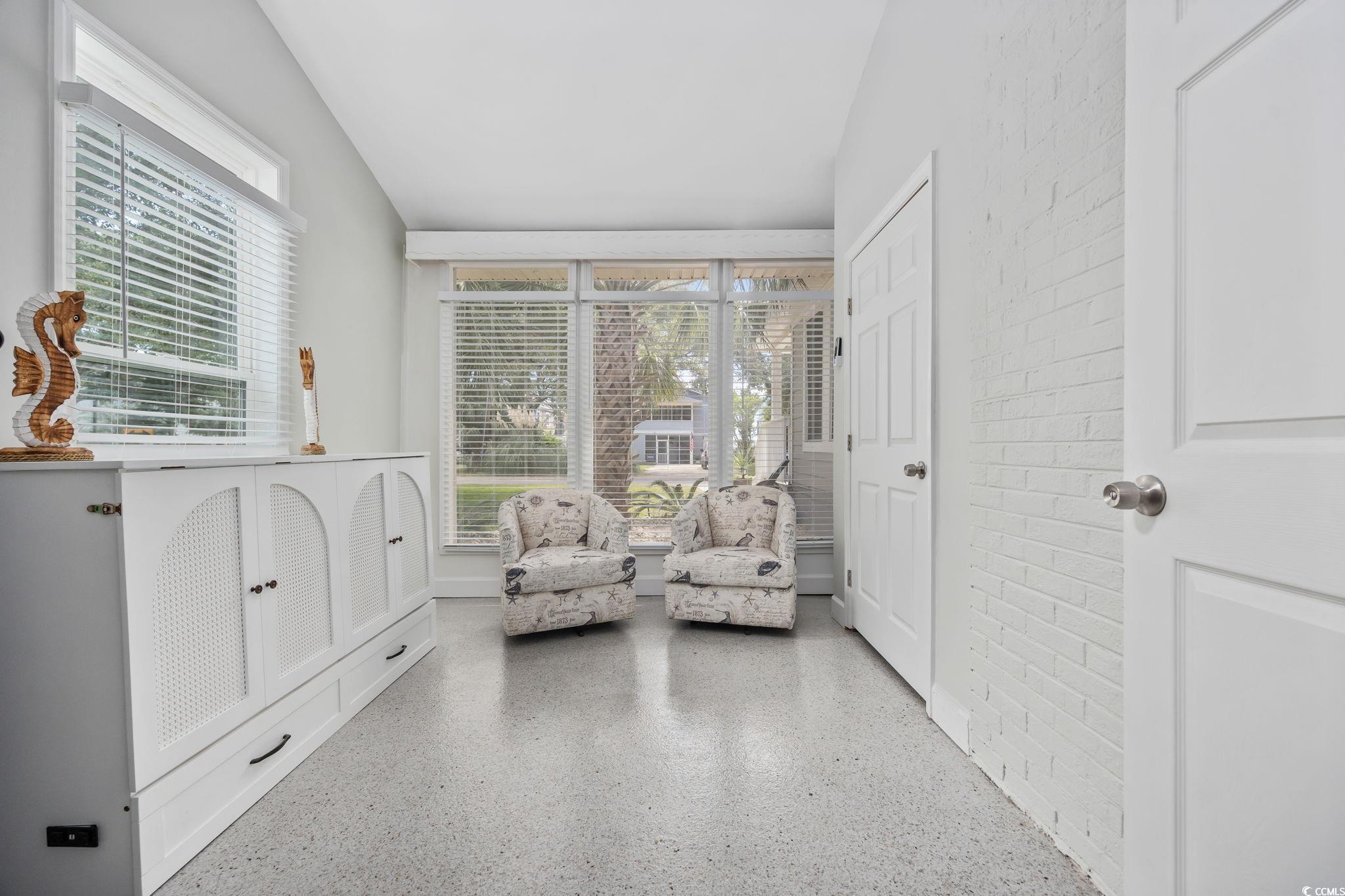 3118 State Rd S-26-816 Murrells Inlet, SC 29576 - Photo 24 of 40 Sitting room with speckle patterned floor and vaulted ceiling