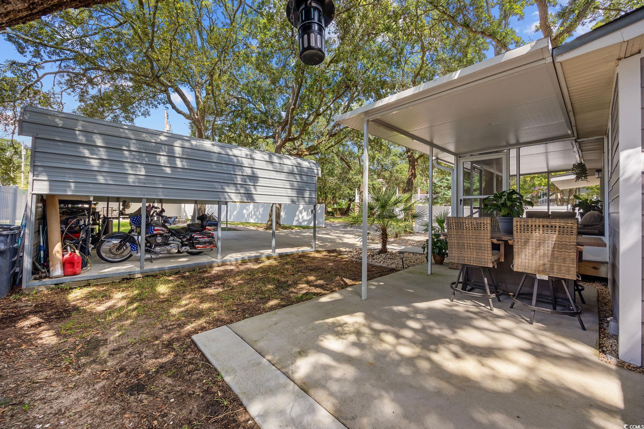 3118 State Rd S-26-816 Murrells Inlet, SC 29576 - Photo 28 of 40 View of patio with a sunroom