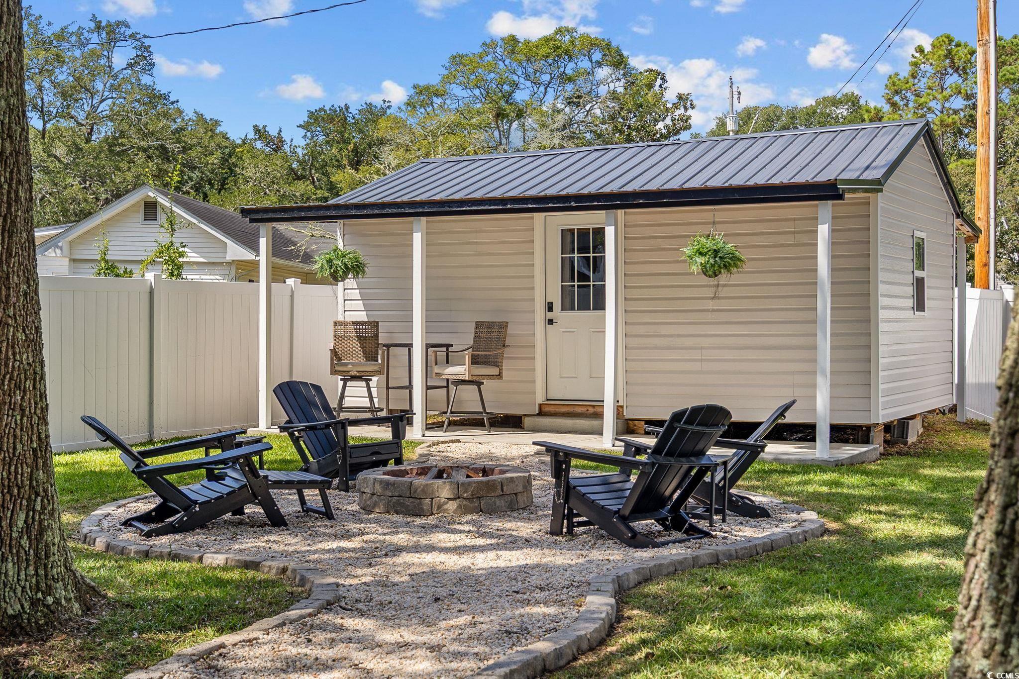 3118 State Rd S-26-816 Murrells Inlet, SC 29576 - Photo 32 of 40 View of outdoor structure with an outdoor fire pit