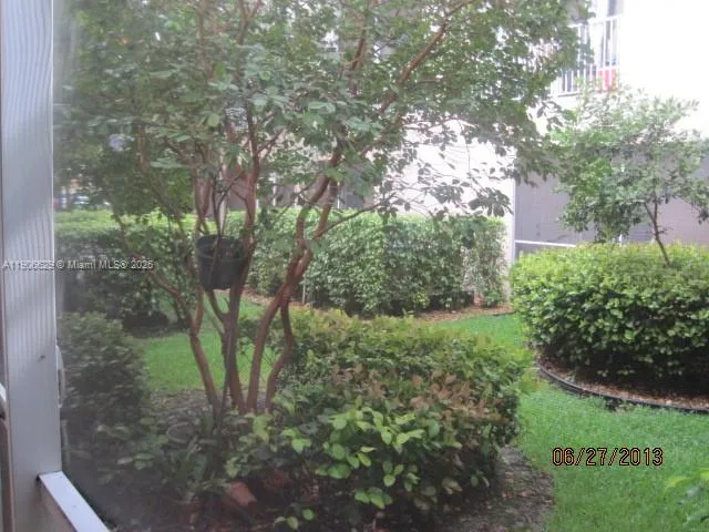 a bathroom with a toilet a sink a mirror a bathtub and vanity