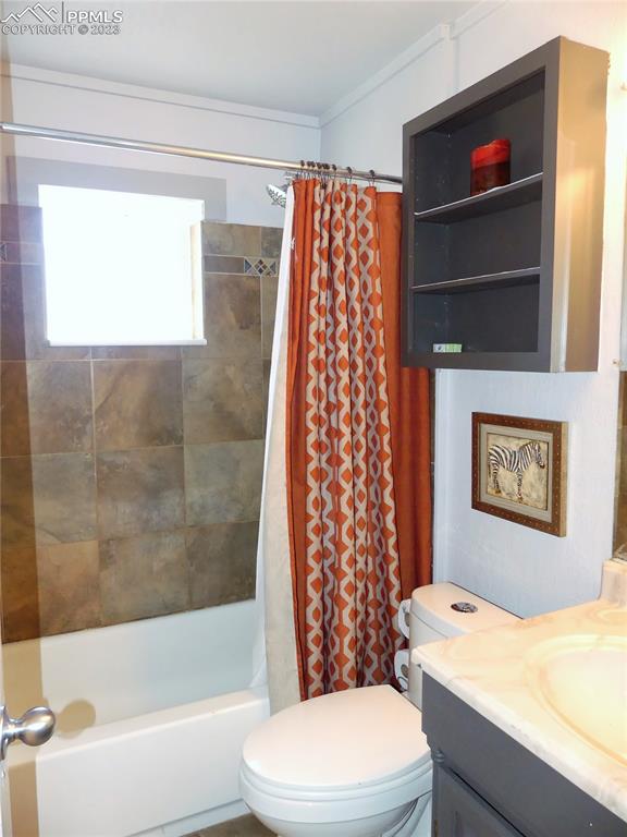 811 Prairie Road Colorado Springs, CO 80909 - Photo 19 of 34 a bathroom with a sink a toilet and shower
