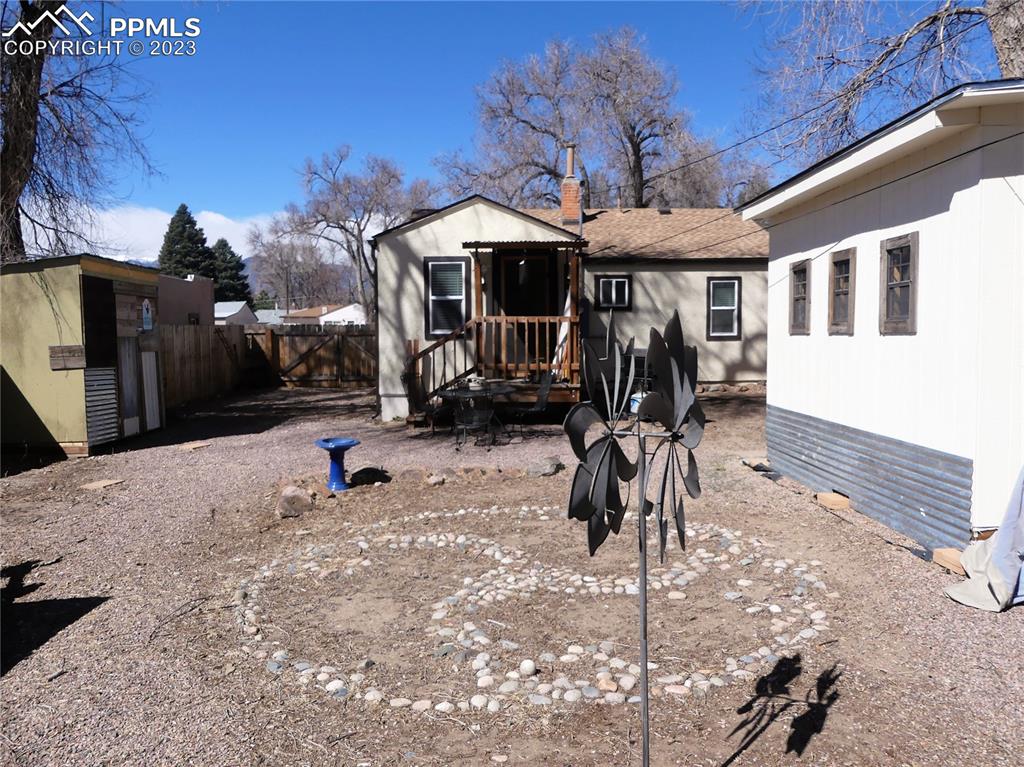 811 Prairie Road Colorado Springs, CO 80909 - Photo 30 of 34 a front view of a house with a patio