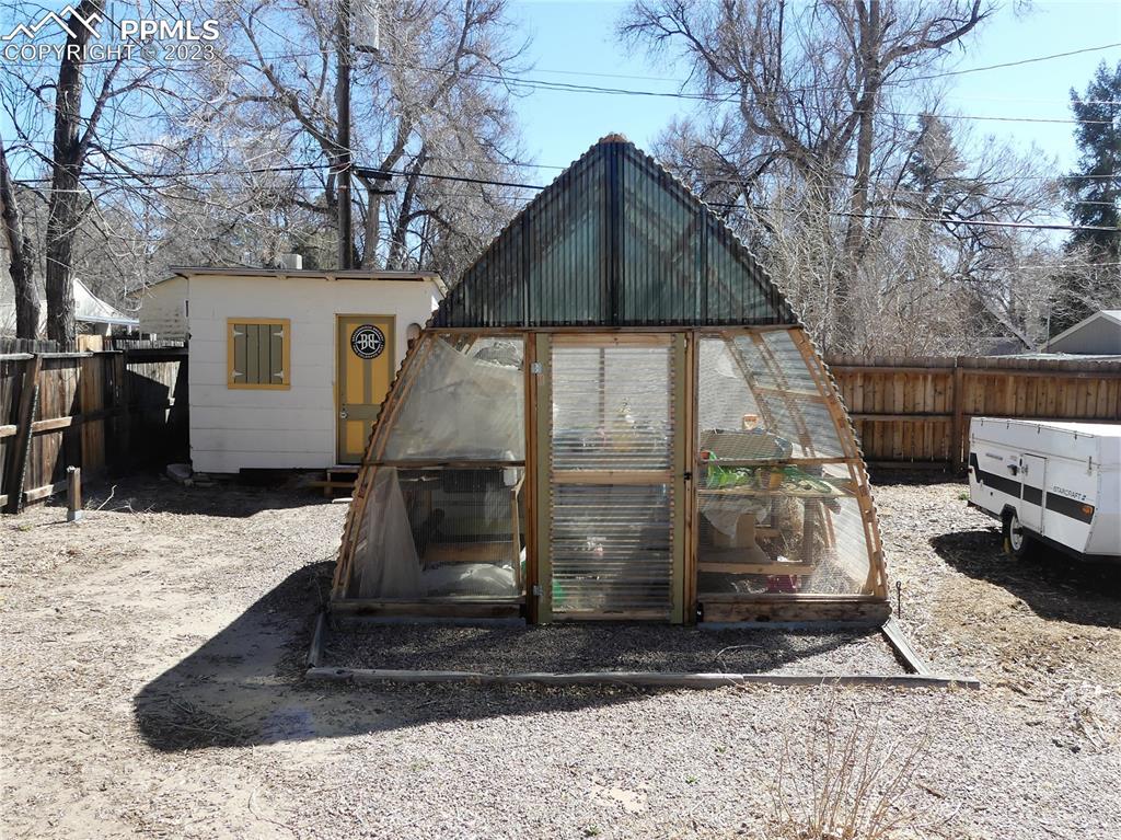 811 Prairie Road Colorado Springs, CO 80909 - Photo 3 of 34 a view of a house with a yard