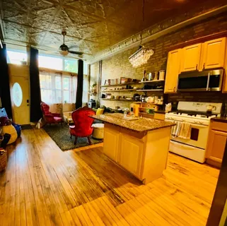 a kitchen with a sink appliances and cabinets