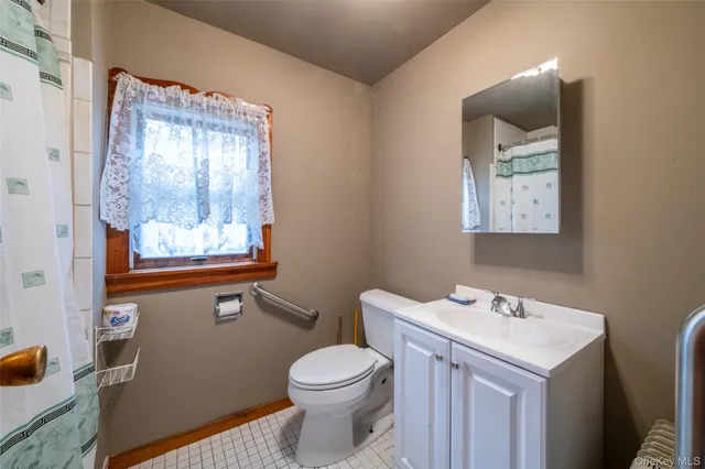 a view of an empty room with a fireplace