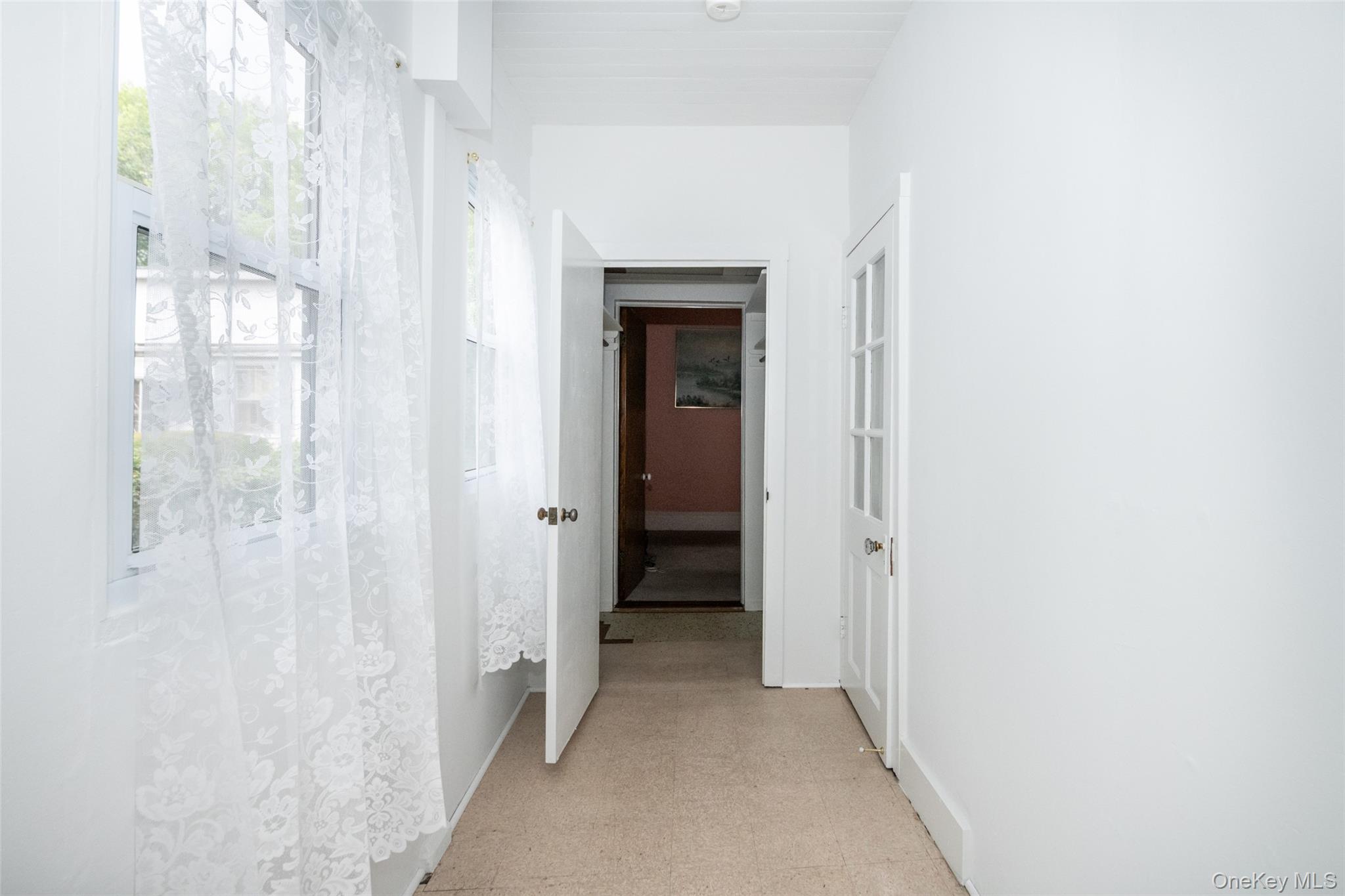 157 Schofield Street Bronx, NY 10464 - Photo 17 of 34 a view of a hallway with wooden shelves