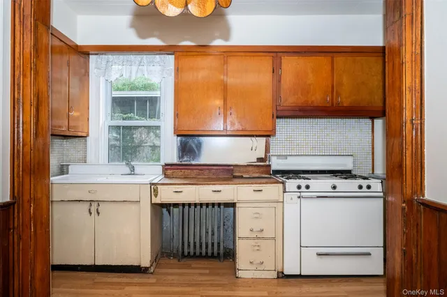 a kitchen with a refrigerator and a sink