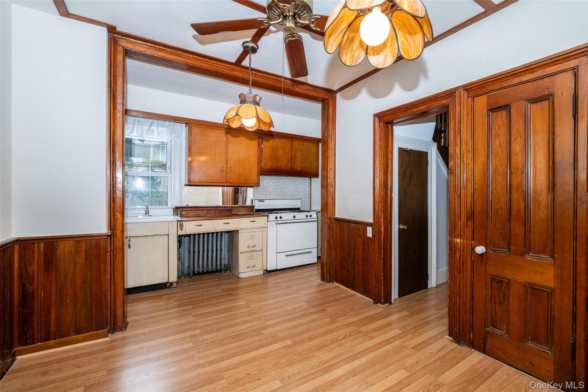 157 Schofield Street Bronx, NY 10464 - Photo 7 of 34 a kitchen with a refrigerator and a sink