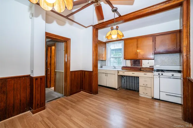 a view of hallway with wooden floor