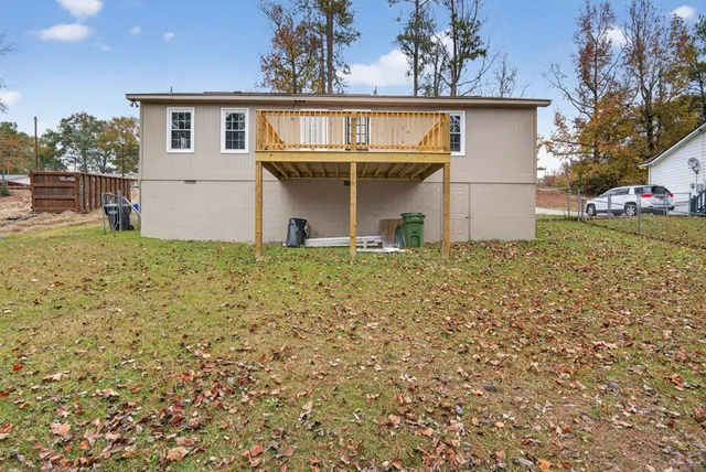 a view of front of house with a yard