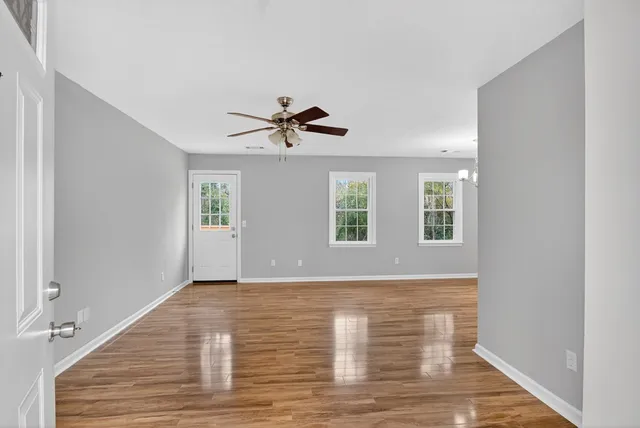 a view of livingroom with hardwood floor and ceiling fan